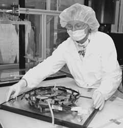 Sharon Austin inspecting F-disk assembly