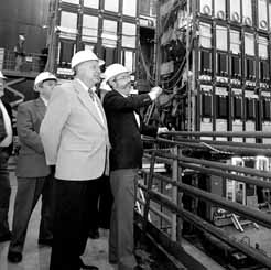 NIU president John Peters (left) and Jerry Blazey view the Dzero detector