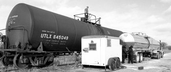 Oil for the MiniBooNE detector arrives at Fermilab by railcars, each holding 23,000 gallons. Ultra-clean tank trucks take the oil to the detector.