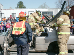 The Fermilab Fire Department demonstrated the Jaws of Life in simulating a rescue from a car wreck.