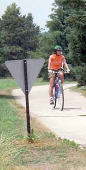 According to Illinois road rules, bicyclists have a choice of traveling on either sidewalks, bike paths or roads, unless otherwise posted.