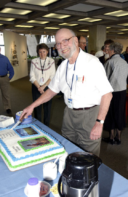 Bob Betz cutting his birthday cake at his 80th birthday party.