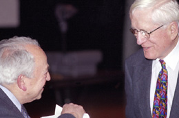 Ramsey catches up on some old stories with Ned Goldwasser, the lab's first deputy director, during the March, 1999 symposium 