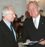 Paul Söding (left) received the German Federal Cross of Merit, First Class, from German Federation President Johannes Rau in September, 2002. Söding was honored for his research in elementary particle physics, and for his dedication in reuniting science and scientists from the old and new German federal states.