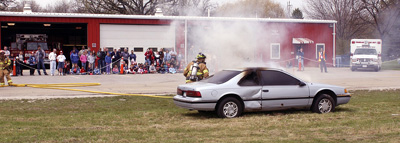 Fermilab's firefighters deomstrate how to put out a car fire.