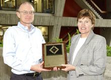 Mike Witherell (left) and Jane Monhart received the award on behalf of Fermilab.