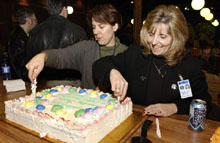 Amy Pavnica (left) and Jo Ann Larson with the safety-record cake