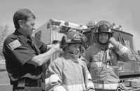 Kids in fire equipment