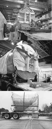 Loading the Central Outer Detector onto a special low-riding truck from its assembly site in Industrial Center Building 4 across road D to CDF