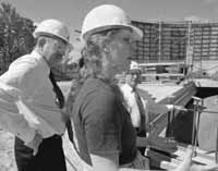 Graduate Student Bonnie Flemming gives SLAC Director Jonathan Dorfan(left) and DOE Associate Director Peter Rosen an update on the MiniBooNe construction