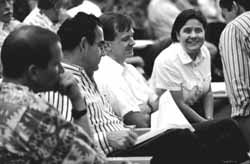 Physicists pack lecture hall at FermiLab to hear DONUT Spokesman Byron Lundberg announce the first direct evidence for the tau neutrino