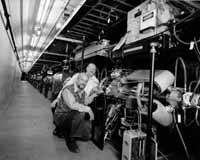 Jonathan Dorfan, Director of SLAC, and Pier Oddone, Deputy Director of LBNL(front), inspect SLAC's PEP II collider.