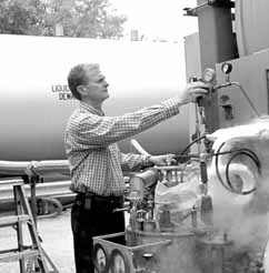 Jay Theilacker inspecting cryogenic equipment