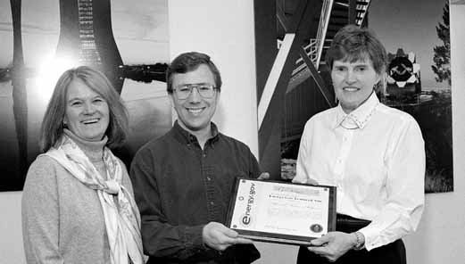Judy Jackson, SDSS webmaster Craig Wiegert and DOE area manager Jane Monhart accept award