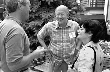 Conference organizer Chris Quigg greets SLAC Director Jonathan Dorfan and Renee Dorfan