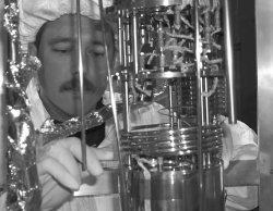 Rich Schmitt works on the cryostat assembly in the clean room at Soudan.