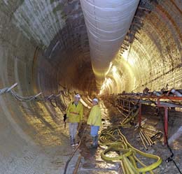 The tunnel boring machine finished its journey through 3,000 feet of rock in December 2001, John Sollo (left), Tom Lackowski and other engineers frequently inspected the progress the machine made