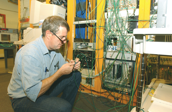 Doug McCormick works in the Next Linear Collider (NLC)research and development group at the Stanford Linear Accelerator Center. He will be responsible for the application of the hardware that has been developed for the NLC project. McCormick set up the electronics that his group from SLAC developed for accelerator subsystems. These electronics facilitate beam transfers between links in the accelerator chain at Fermilab.