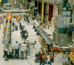 Large Hadron Collider magnet production at Fermilabs Industrial Center Building.The European high-energy physics community seized the opportunity to build this collider and has happily bet its future on it.The LHC project involves an unprecedented U.S.-Europe collaboration,the success of which has accelerated the internationalization of physics. 