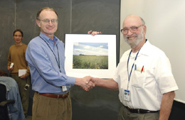Fermilab Director Michael Witherell presented a certificate of appreciation and a commemorative photo to prairie project founder Bob Betz.