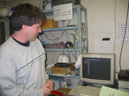 Boston University physicist and K2K collaborator Chris Walter watches over the experiment's near detector as it monitors the neutrino beam before it leaves the KEK site for its 250-kilometer trip to the Super-K detector.