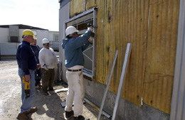 Workers of contractor Pandecon Construction remove just about everything that can be removed from the corrugated steel building for recycling before tearing it down.Even the concrete of the foundations will be excavated,broken up and recycled.Ron Pansing of Pandecon says it takes about two days to remove all the components from interior,then about two hours to knock down the building. Excavating the concrete foundation takes about four hours.