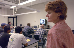 Mary Logue, of the Environment, Safety and Health Section at Fermilab, frequently provides training to subcontractors coming to Fermilab. All subcontractors have to go through a half hour orientation to learn about potential hazards and emergency signals. Depending on the tasks at hand, additional training may be required.