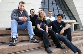 The 2003 GSA Representatives (from left to right): Martin Hennecke, Karlsruhe University, CDF; Andy Haas, University of Washington, DZero; Amber Jenkins, Imperial College London, DZero; Reid Mumford, John Hopkins University, CDF and Jun Zhang, Columbia University, Astro-Theory.