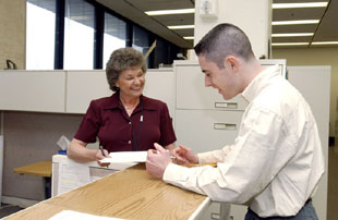 The Users Office, headed by Dianne Snyder, is the first stop for every new user. Sooner or later all users, like Bruce Knuteson who has worked on Fermilab experiments for six years, return to the Office to obtain more information or to file additional paperwork.