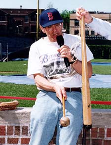 Alan Nathan demonstrates the sweet spot of a bat at Wrigley Field - in a Red Sox cap. (Photo courtesy Alan Nathan)