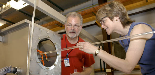 Chuck Serritella and Anna Pla-Dalmau get a feel for scintillating plastic emerging from the extruder line.
