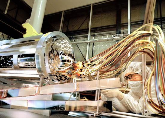 Fermilab physicist Brenna Flaugher checks connections for a silicon vertex detector for the CDF experiment.