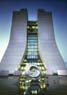 Fermilab's Wilson Hall and, in the foreground, the sculpture 'Mobius Strip' by Fermilab's founding director Robert Wilson.