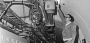 A staff member works on installation of the Energy Saver/Doubler, later named the Tevatron